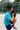 Student holding rechargeable battery pack with micro:bit on baseball field | Forward Education