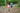 Two children on forest trail holding portable battery packs for micro:bit devices | Forward Education