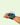 Micro:bit microcontroller with blue case worn on wrist with red wired connectors | Forward Education
