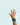 Child's hand wearing microcontroller board with circuit board background pattern | Forward Education