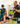 Student and adults exploring robotics kit with laptop in classroom setting | Forward Education