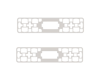 Two gray plastic frame connectors with white rectangular mounting slots and center openings | Forward Education