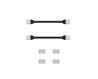 Two black cables with gray connectors and four gray cable extender blocks on white background | Forward Education