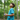 Boy in the forest exploring with CHARGE for micro:bit and pressing buttons to collect data