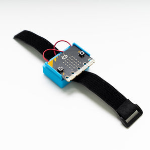 Charge for micro:bit with wrist strap laid flat