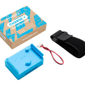 Flat lay photo showing the contents of the CHARGE for micro:bit product