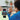 Child wearing blue wearable microcontroller with red cables while coding on laptop | Forward Education