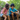 Kids sitting on a log with CHARGE for micro:bit collecting data