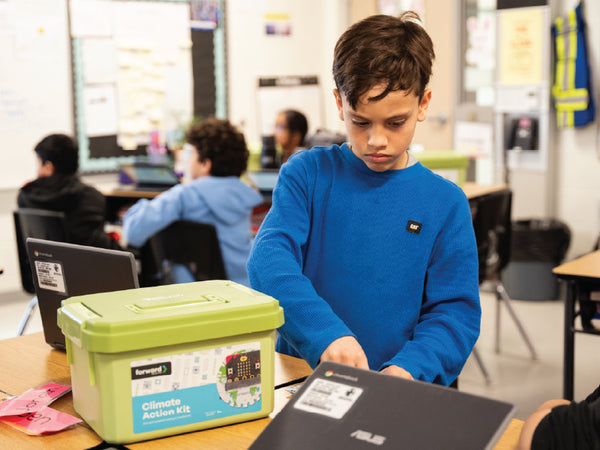 Climate Action Kit in bright green container with micro:bit board visible | Forward Education