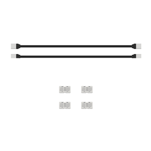 Two black cables with connectors and four white cable extender blocks on white background | Forward Education
