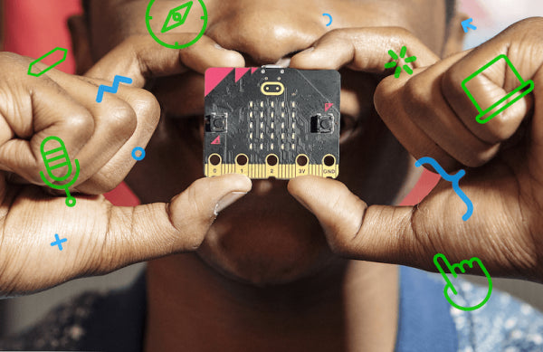 A student holding a micro:bit with two hands